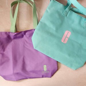 Clinique cosmetic light green tote bag pastel purple bundle of 2 shopping reusab